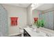 Bathroom with double sink, large mirror, decorative shower curtain and red towels at 769 Canberra Blvd, Westfield, IN 46074