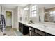 This bathroom features a double sink vanity, large mirror, walk-in shower, and warm neutral colors at 769 Canberra Blvd, Westfield, IN 46074