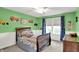 Fun and creative ' bedroom with green walls, playful decor, and a cozy twin bed at 769 Canberra Blvd, Westfield, IN 46074