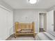 Simple bedroom with a crib, closet, neutral paint and carpeting at 769 Canberra Blvd, Westfield, IN 46074