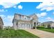 Stunning two-story house with stone and siding, featuring a lush green lawn and a convenient driveway approach at 769 Canberra Blvd, Westfield, IN 46074