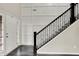 Elegant foyer featuring a staircase with iron railings and paneled wall at 769 Canberra Blvd, Westfield, IN 46074