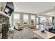 Spacious living room with a stone fireplace and lots of natural light from large windows at 769 Canberra Blvd, Westfield, IN 46074