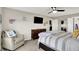 Bright main bedroom with a ceiling fan, dresser, and a chair next to the bed at 769 Canberra Blvd, Westfield, IN 46074