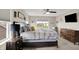 Bright main bedroom with a window, dresser, carpet, and a plush comfortable bed at 769 Canberra Blvd, Westfield, IN 46074