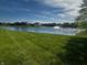 Beautiful community pond view near lush grass and nearby homes at 769 Canberra Blvd, Westfield, IN 46074