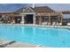 Sparkling community pool with pergola-covered seating area and ample lounge chairs at 769 Canberra Blvd, Westfield, IN 46074