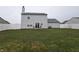 Spacious backyard features a patio with seating and a privacy fence, perfect for outdoor enjoyment at 7814 Crooked Meadows Dr, Indianapolis, IN 46268