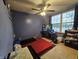 Blue bedroom with carpet, a flat screen television, and natural light from the window at 7814 Crooked Meadows Dr, Indianapolis, IN 46268