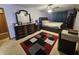 Bedroom with a ceiling fan, carpeted floors, and dark wood furniture offering comfort and relaxation at 7814 Crooked Meadows Dr, Indianapolis, IN 46268