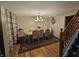 Elegant dining room showcasing wood floors, a large table with seating for six and decorative lighting at 7814 Crooked Meadows Dr, Indianapolis, IN 46268