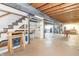 Bright unfinished basement offers open space, built-in shelving, and exposed beams, great for storage at 8292 E 100 S, Greenfield, IN 46140