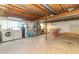 Unfinished basement with washer, dryer, water heater, and workbench for potential customization at 8292 E 100 S, Greenfield, IN 46140
