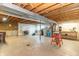 Spacious unfinished basement includes laundry area, wood beams and concrete flooring with space for storage and utilities at 8292 E 100 S, Greenfield, IN 46140