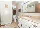 Bathroom featuring single sink vanity with granite countertop and a mirror at 8292 E 100 S, Greenfield, IN 46140
