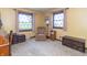 Bedroom features neutral walls, two large windows and ample seating at 8292 E 100 S, Greenfield, IN 46140
