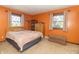 Bedroom features warm-colored walls, two large windows and ample closet space at 8292 E 100 S, Greenfield, IN 46140