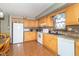 Well-lit kitchen featuring wood cabinets, modern appliances, and ample counter space at 8292 E 100 S, Greenfield, IN 46140