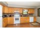 This kitchen features wood cabinets, and ample counter space at 8292 E 100 S, Greenfield, IN 46140