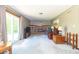 Open-concept living room featuring a cozy brick fireplace, sliding doors, and neutral decor providing ample space at 8292 E 100 S, Greenfield, IN 46140