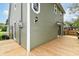 Spacious wooden deck wrapping around the corner of the home, providing seamless indoor-outdoor living at 8308 W Main St, Coatesville, IN 46121