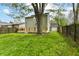 Spacious backyard featuring a large tree and a newly constructed wooden deck at 8308 W Main St, Coatesville, IN 46121