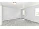 Bright bedroom with gray walls, plush gray carpet, and natural light from a double window at 8308 W Main St, Coatesville, IN 46121