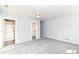 Bedroom with ensuite bath and closet featuring new carpet and neutral paint at 8308 W Main St, Coatesville, IN 46121