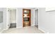 Open interior view showcasing the bathroom, kitchen, and main room at 8308 W Main St, Coatesville, IN 46121