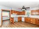 Modern kitchen featuring wood cabinetry, white counters and backsplash, and open layout at 8308 W Main St, Coatesville, IN 46121