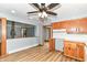 Updated kitchen with wood cabinets, white tile backsplash, and an open layout at 8308 W Main St, Coatesville, IN 46121