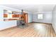 Bright living room with a rustic wood burning stove and seamless access to the kitchen at 8308 W Main St, Coatesville, IN 46121