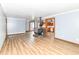 Open-concept living room with a wood burning stove and view of the kitchen at 8308 W Main St, Coatesville, IN 46121