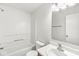Well-lit bathroom featuring a shower-tub combo, modern vanity, and a large mirror at 8910 Youngs Creek Ln, Indianapolis, IN 46113