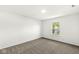 Bright bedroom with plush carpet and a large window offering a serene view at 8910 Youngs Creek Ln, Indianapolis, IN 46113