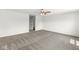 Large bedroom with neutral carpet, ceiling fan, and an en suite bathroom at 8910 Youngs Creek Ln, Indianapolis, IN 46113