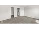 Large bedroom offering neutral carpet, fresh paint, and access to a walk-in closet at 8910 Youngs Creek Ln, Indianapolis, IN 46113