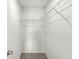 Walk-in closet featuring wire shelving and neutral carpet, ideal for organization at 8910 Youngs Creek Ln, Indianapolis, IN 46113