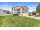 Well maintained, two-story home with manicured lawn, two-car garage and vinyl and brick facade at 8910 Youngs Creek Ln, Indianapolis, IN 46113