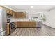 Bright kitchen featuring stainless steel appliances and custom backsplash at 8910 Youngs Creek Ln, Indianapolis, IN 46113