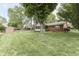 Spacious backyard featuring a mix of brick, wood, and siding, perfect for outdoor enjoyment at 912 Ramblin Rd, Greenwood, IN 46142