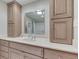 Bathroom featuring wood cabinets with matching cabinet tower and framed mirror at 912 Ramblin Rd, Greenwood, IN 46142
