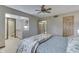 Bedroom featuring ensuite bath with sink and cabinet, ceiling fan, and closet at 912 Ramblin Rd, Greenwood, IN 46142