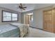 Cozy bedroom with natural light, featuring a ceiling fan, closet and full-size bed at 912 Ramblin Rd, Greenwood, IN 46142