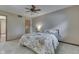 Comfortable bedroom with a ceiling fan and full-size bed with patterned comforter at 912 Ramblin Rd, Greenwood, IN 46142