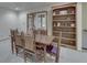 Formal dining room with stylish table and chairs, complemented by a built-in bookshelf at 912 Ramblin Rd, Greenwood, IN 46142