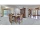 Well-lit dining room featuring a table, six chairs, and elegant wood furniture and decor at 912 Ramblin Rd, Greenwood, IN 46142