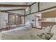 Cozy living room featuring beamed ceilings, neutral decor, and an open layout to the kitchen and foyer at 912 Ramblin Rd, Greenwood, IN 46142