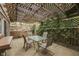 Charming outdoor patio with a trellis and dining area perfect for entertaining guests at 912 Ramblin Rd, Greenwood, IN 46142