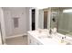 Neutral bathroom features double sinks, and a glass enclosed shower plus a walk-in closet at 9176 Springbrook Dr, Pendleton, IN 46064